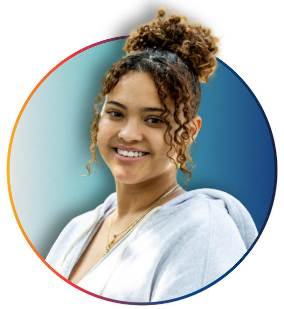 PCOM student with curly hair in a ponytail smiling, framed in a circular graphic with red and blue accents