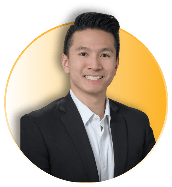 Brandon Dang smiling in a dark blazer and white dress shirt inside a circular frame with a gold accent border