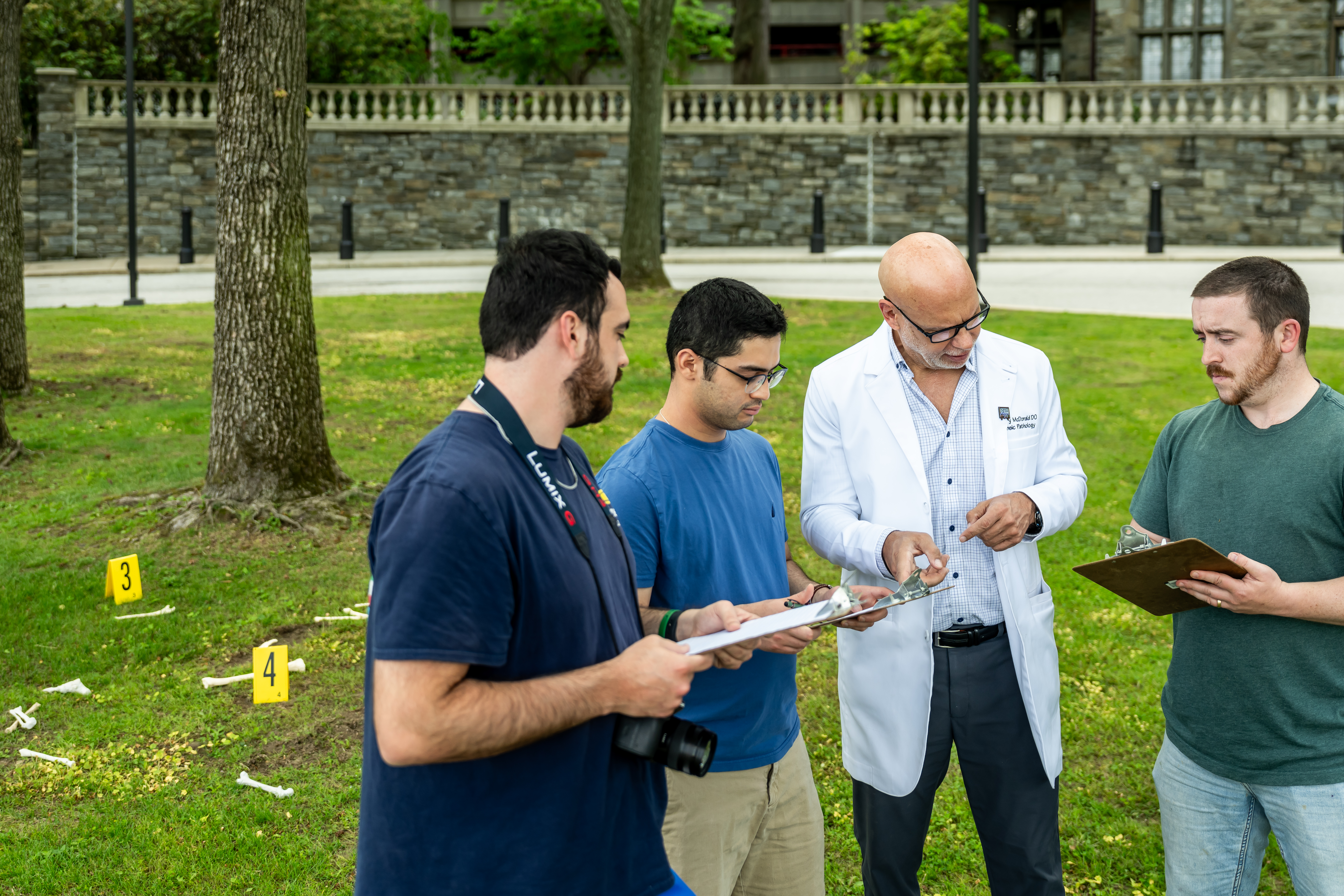 Dr. Gregory McDonald and students assessing a mock crime scene
